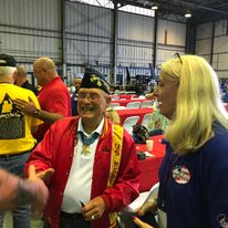 Connecting with a fellow veteran at a community event.